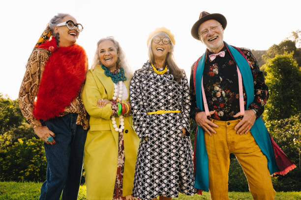 istock Happy elderly people laughing in a park 1367959116