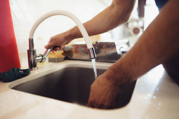 istock Chef washing his hands in a restaurant kitchen sink 1367961163
