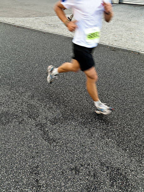 istock Man running in city marathon 136796146