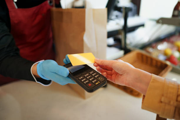 istock Close up of paying credit card for purchases process. 1367961791