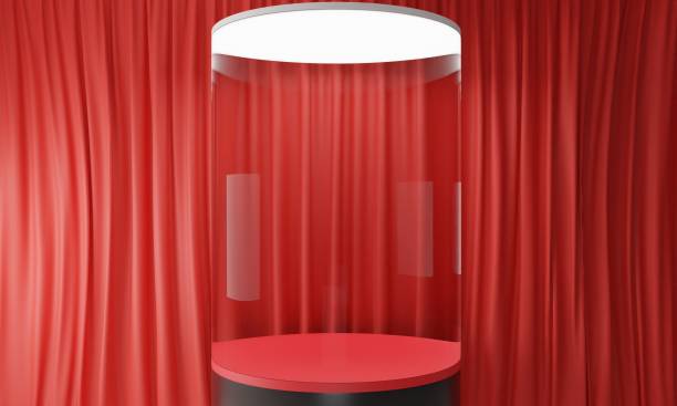istock glass podium with red curtain studio room.3d rendering. 1367962665