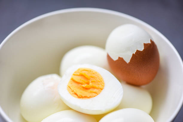 istock Eggs breakfast, fresh peeled eggs menu food boiled eggs in a bowl and eggshell, cut in half egg yolks for cooking healthy eating 1367962695