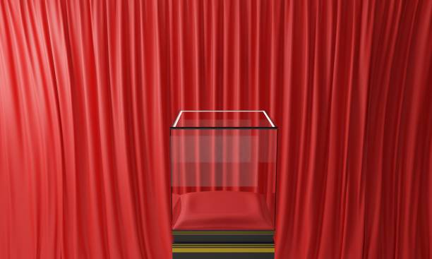 istock glass podium with red curtain studio room.3d rendering. 1367962845