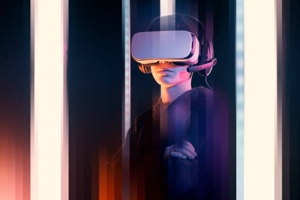 istock Teenager with VR headset experiencing virtual reality 1367965402