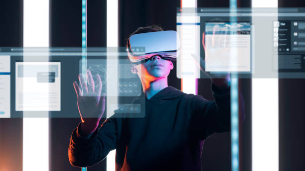 istock Teenager interacting with virtual screens 1367965416