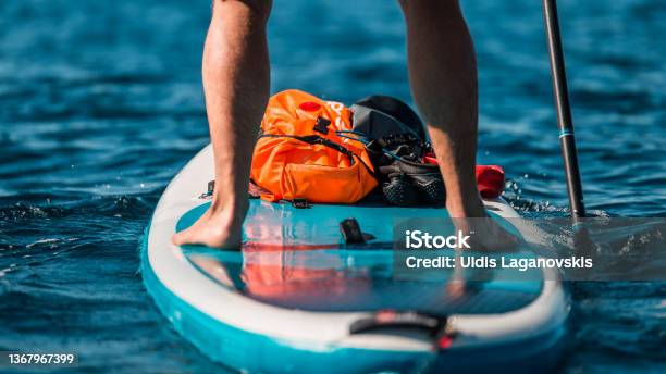 Young Athletic Man Paddling On A Sup Stand Up Paddle Board In Blue Water Sea In Montenegro Stock Photo - Download Image Now