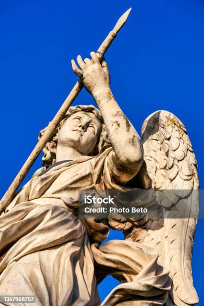 The Detail Of A Statue Of An Angel By Bernini In The Historic And Baroque Heart Of Rome Stock Photo - Download Image Now