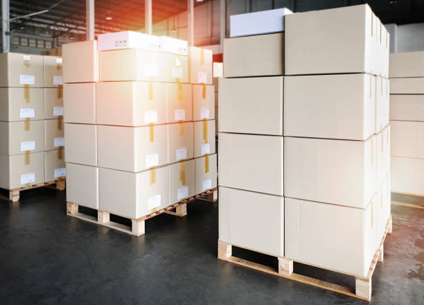 istock Packaging Boxes on Pallets Racks in Storage Warehouse. Supply Chain. Storehouse Shipment Goods. Distribution Warehouse Shipping Logistics. 1367969873