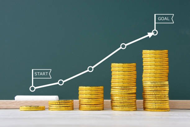 l’argent s’est progressivement accumulé et précédait du début au but - marquer un but photos et images de collection