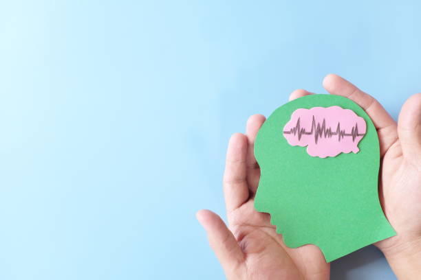 istock Hands holding human head profile cutout with healthy brain. Care for good memory, ADHD, Alzheimer, stroke, dementia prevention and world mental health day awareness concept. 1367970697