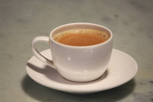 istock A white cup with saucer filled with tea ( chai ) 1367974457