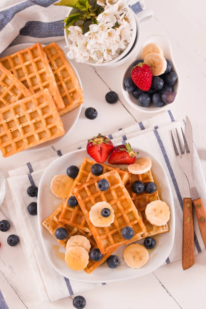 istock Waffles with blueberries, bananas and honey. 1367974611
