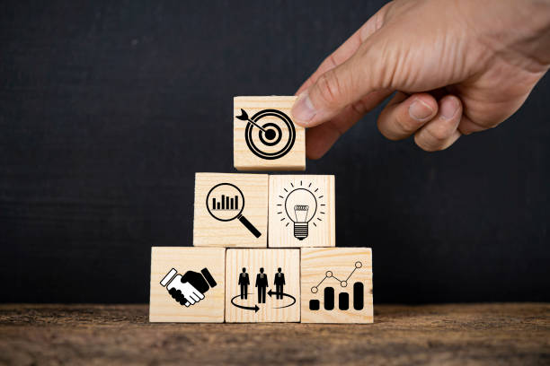 istock Hand putting print screen dart and target board wooden cube with magnifier glass graph and cog. 1367976750