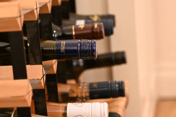 istock An angled view of a rectangular wine rack holding a mixture of wine bottles fading into the background 1367978130