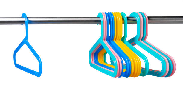 istock Metal rack with clothes hangers on white background 1367978376