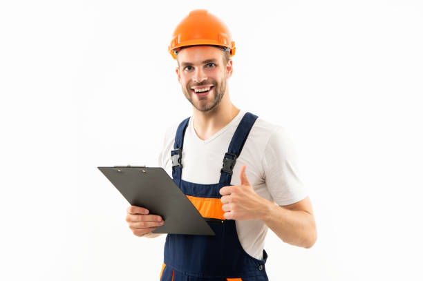 istock cheerful man in helmet hold project. construction documents. signing a contract. 1367979124