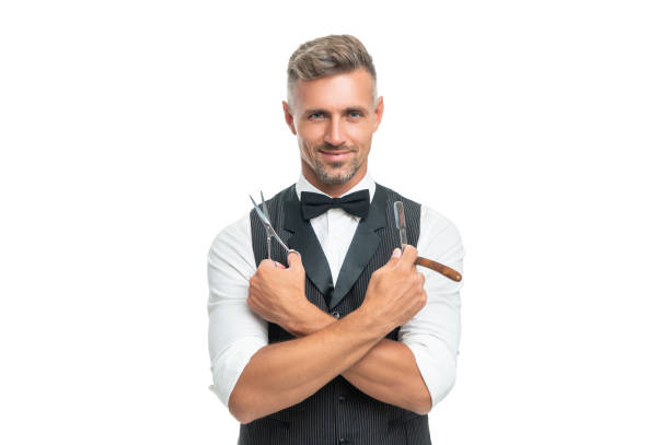 istock happy man barber with razor blade and scissors in bow tie isolated on white background 1367979257