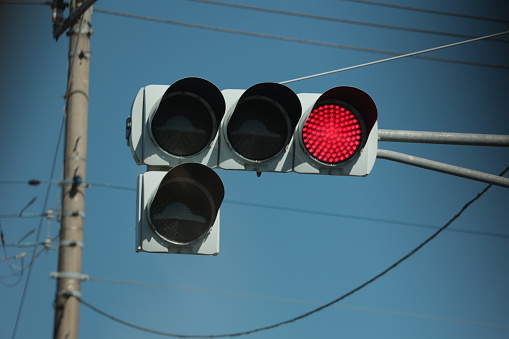 The red light, a traffic light in Japan, means stop.