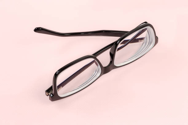 istock Classic eyeglasses in black plastic frame with partly folded temples 1367979442