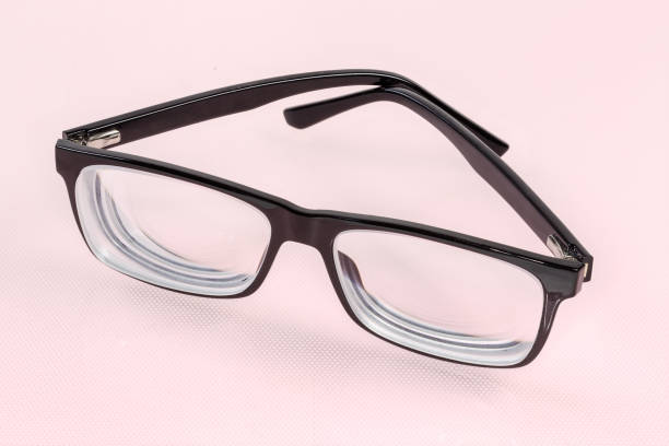 istock Classic eyeglasses in black plastic frame with partly folded temples 1367979454