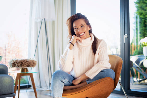 istock Happy woman relaxing at home 1367979468