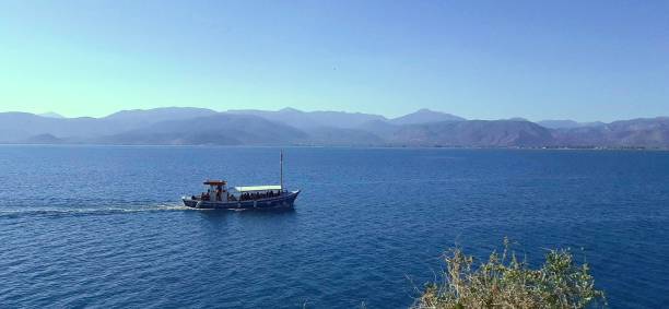 istock Fishing boat in the blue sea 1367980355