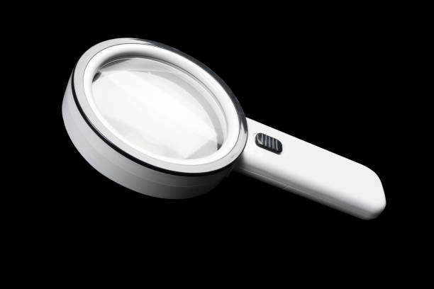 istock Magnifying glass isolated on black background. Magnifying glass for detailed image 1367980584