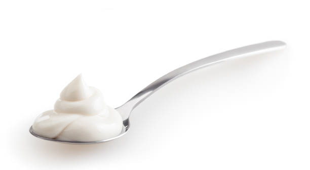 istock Spoon of mayonnaise isolated on white background with clipping path 1367980682