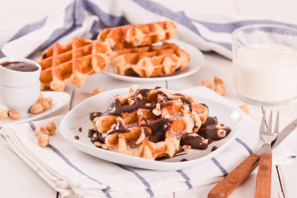 istock Waffles with chocolate cream and hazelnuts. 1367981838