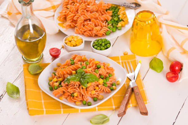 istock Fusilli pasta with peas and sweet corn. 1367982605