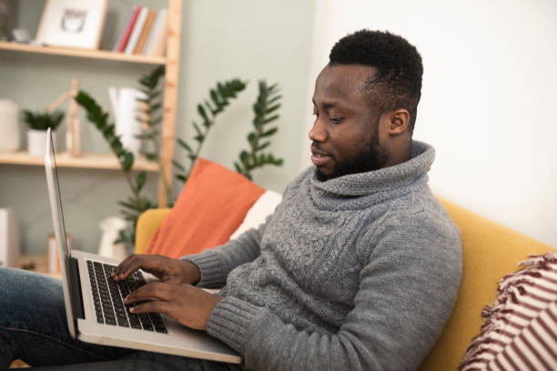 istock Young African American freelancer working from his living room 1367982715