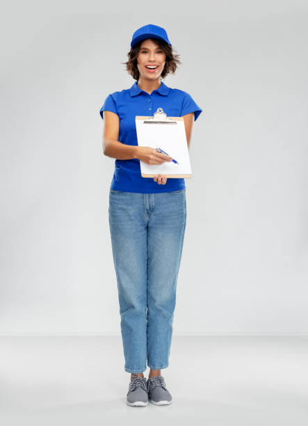 istock happy smiling delivery woman with clipboard 1367984061