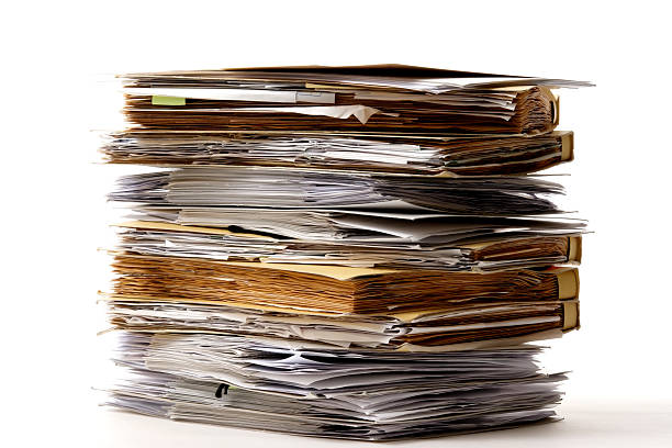 istock Isolated shot of stacked file folders on white background 136798421