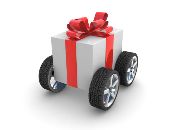istock Gift Box with Red Ribbon on wheels 1367985049