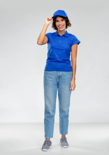happy smiling delivery woman in blue uniform