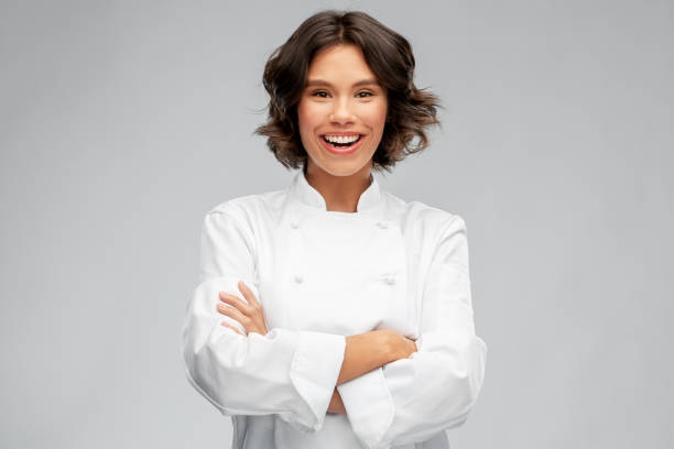 istock smiling female chef in toque 1367985293