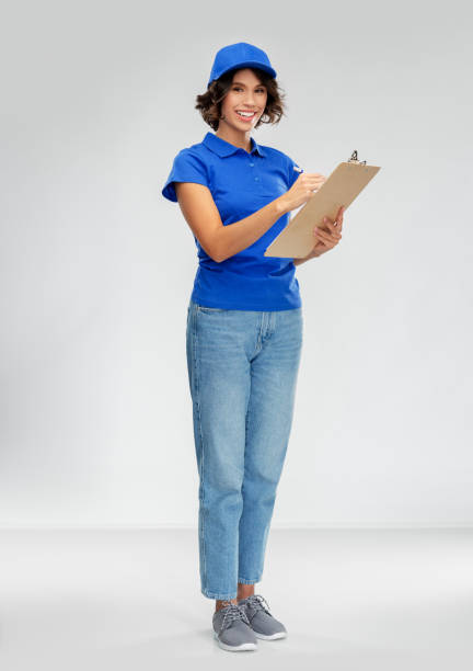 istock happy smiling delivery woman with clipboard 1367985673