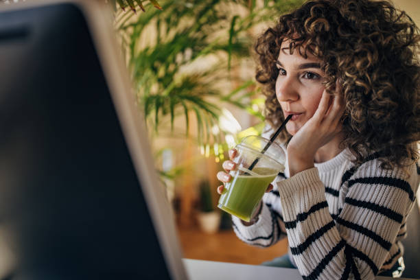 istock Woman drinking smoothie 1367987490