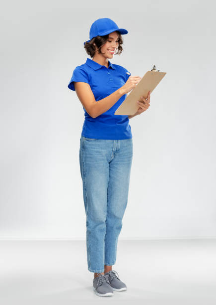 istock happy smiling delivery woman with clipboard 1367988369