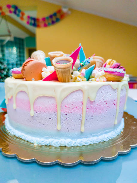 Beautiful Birthday Cake Decorated with Colorful Macarons, Donuts, Sprinkles,....