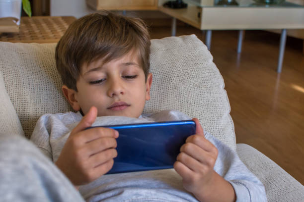 istock Playing Video Games On Smartphone 1367991483