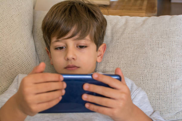 istock Playing Video Games On Smartphone 1367991525
