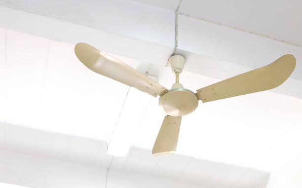 istock Old style electric ceiling fan inside the building. 1367991732