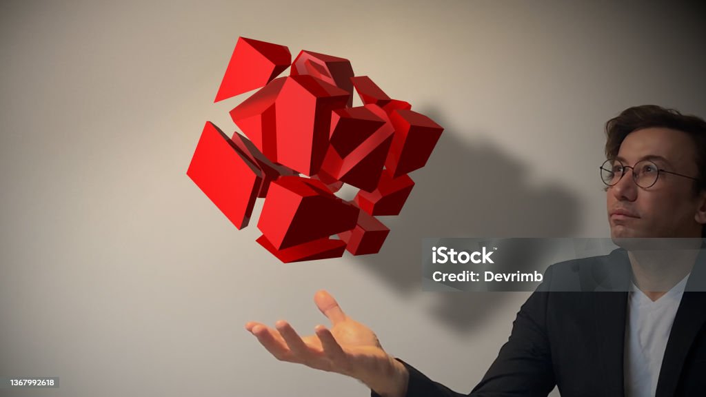 Virtual Puzzle Cube Future of art and technology. An intelligent man who disassembles and reassembles a cube-shaped structure in a virtual reality environment. Soon the games will be built on virtual reality architecture. / You can see the animation movie of this image from my iStock video portfolio. Video number: 1367331101 Puzzle Cube Stock Photo