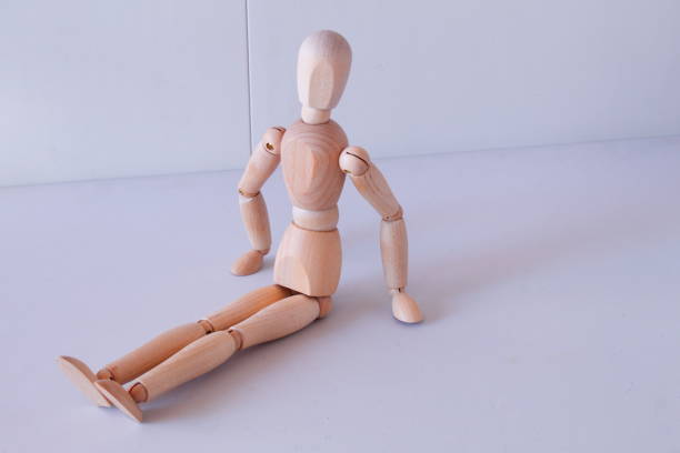 istock Wooden figure as a model for exercising at home 1367995366