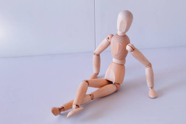 istock Wooden figure as a model for exercising at home 1367995370