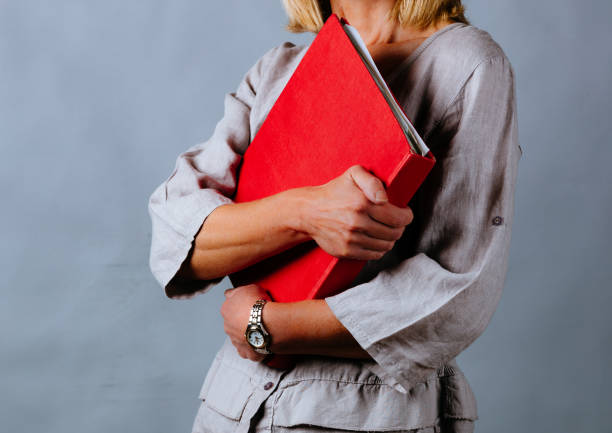 istock Business woman holding a folder 1367995723