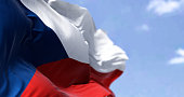 Detail of the national flag of Czech Republic waving in the wind on a clear day. Democracy and politics. Patriotism. Central european country. Selective focus.
