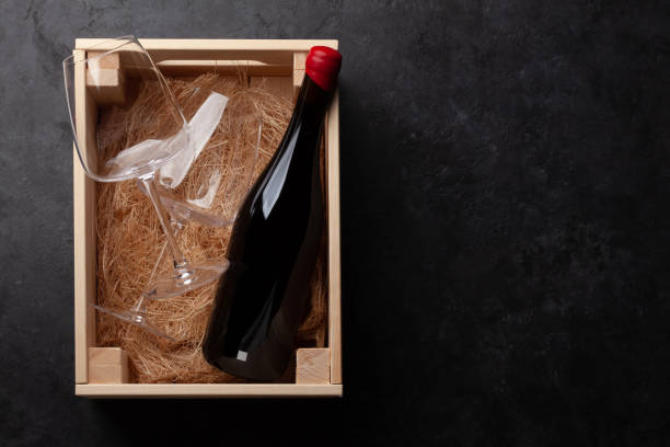 istock Red wine and glasses in wooden box 1367996940