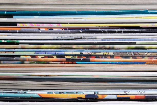 istock Full frame stack of magazines in front of bookshelf 1367997623